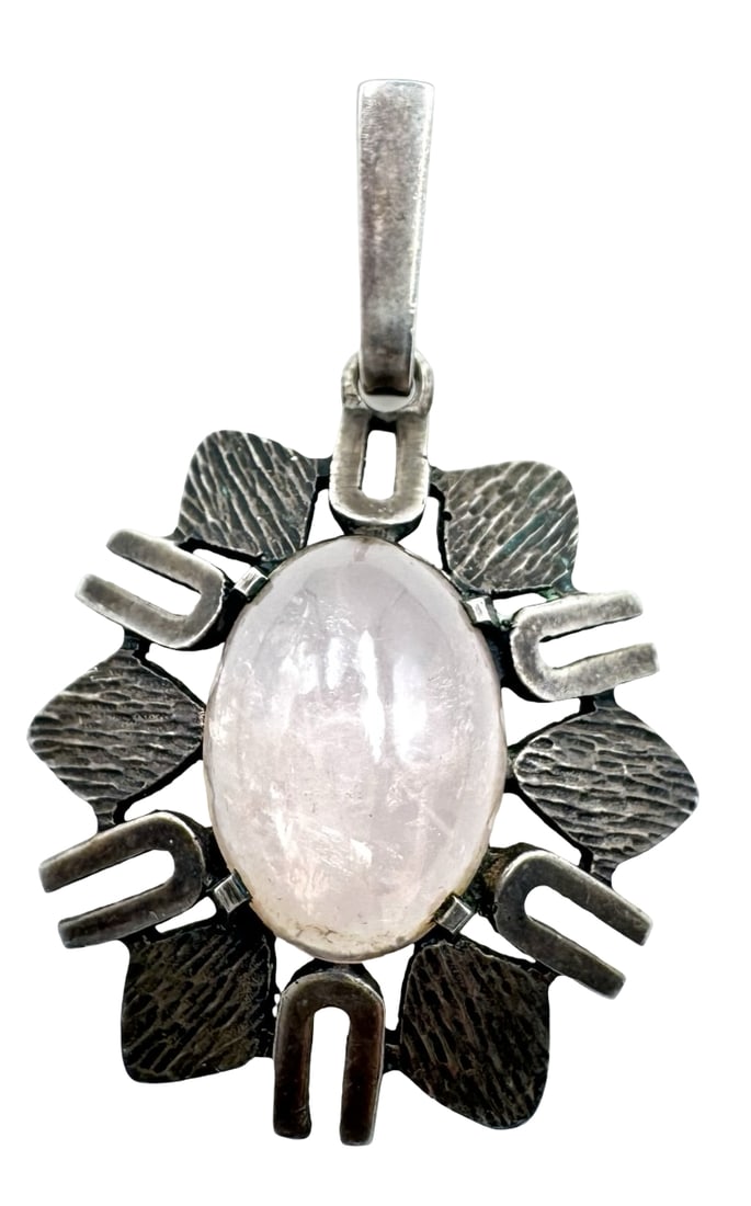 Vintage Mid-Century Modern Sterling Silver & Rose Quartz Pendant: Very good vintage condition with minor patina according to age. Measures approx. 2" long x 1 3/8" wide and weighs ca. 8.7 grams. Tested for a minimum of 835 (83.5%) silver and carrying an unidentified