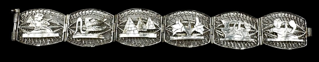 Vintage European 800 Silver Egyptian Revival Bracelet: Very good vintage condition with minor patina according to age. Measures approx. 7" long x 7/8" wide and weighs ca. 23.4 grams. Tested for a minimum of 800 (80%) silver. SHIPPING: We ship in-house and