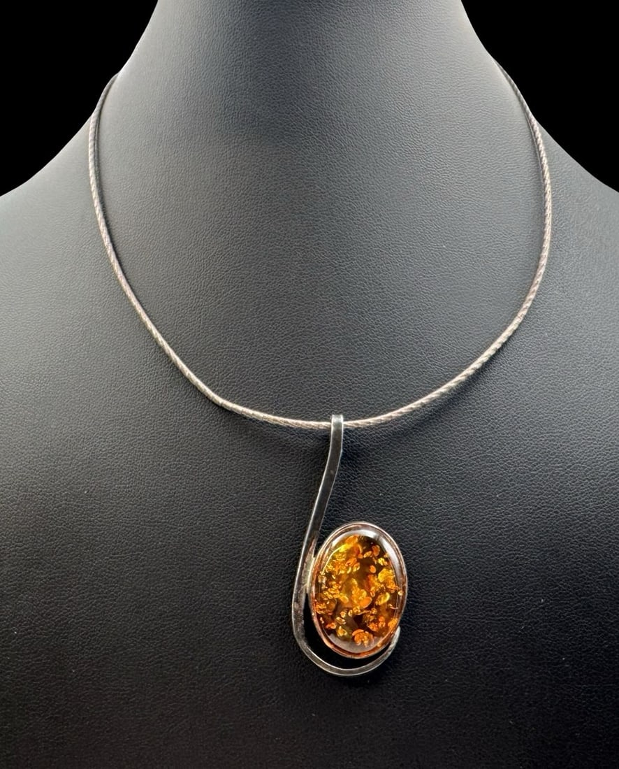 Stunning Vintage Sterling Silver & Baltic Amber Necklace: Very good vintage condition with minor patina according to age. Pendant measures approx. 2" long & 7/8" wide & weighs ca. 12.6 grams. Necklace is 15" long. Marked for Sterling Silver. SHIPPING: We shi