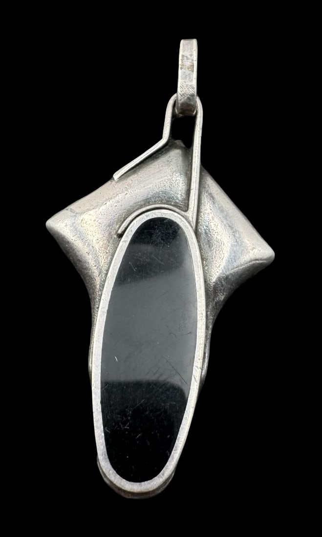Vintage Mid-Century Modern Sterling Silver & Black Onyx Pendant: Very good vintage condition with minor patina according to age. Measures approx. 1 5/8" long and 7/8" wide & weighs ca. 6.1 grams. Marked for Sterling Silver. SHIPPING: We ship in-house and charge a f