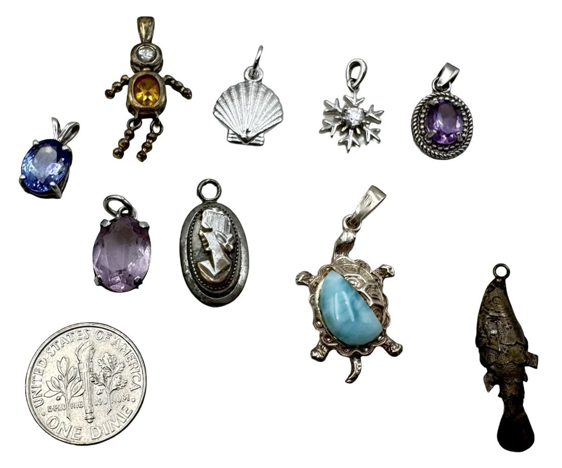 Set of 9 Vintage Sterling Silver Pendant Charms: Very good vintage condition with minor patina according to age. The largest piece measures approx. 1 1/4" long and 1/2" wide and they jointly weigh ca. 12.6 grams. Marked for Sterling Silver. SHIPPING