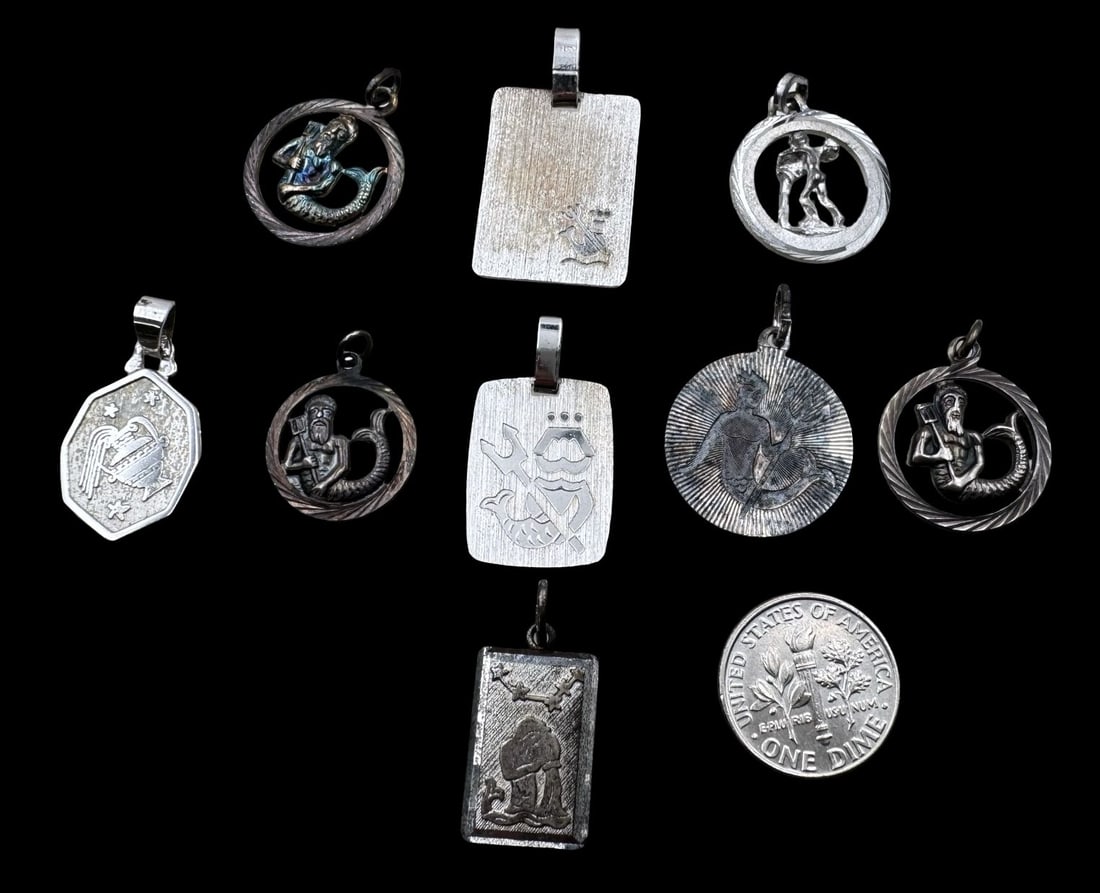 Lot of 9 Vintage Sterling Silver Zodiac Sign Pendant Charms - Aquarius: Very good vintage condition with minor patina according to age. The largest measures approx. 1" long x 5/8" wide and they jointly weigh ca. 18.8 grams. Marked for Sterling Silver. SHIPPING: We ship in