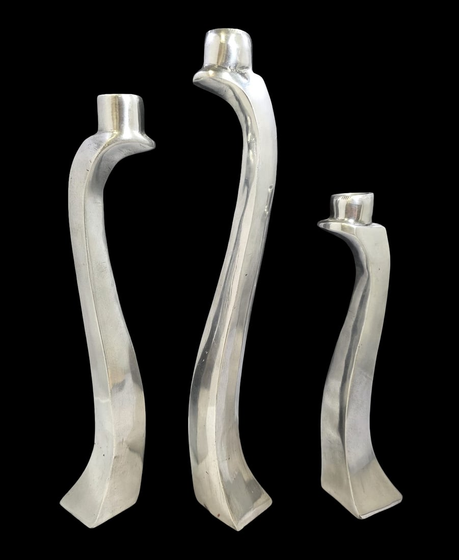Trio of Cool 1980s Aluminium Biomorphic "Nessy" Candlesticks: Very decorative pieces made of solid aluminum. Very good vintage condition with minor wear according to age. Each measures 2" long x 2" wide (base) and has a 7/8" diameter opening. The pieces measure
