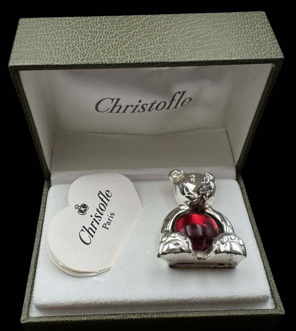 Vintage CHRISTOFLE France Silveplate Bear & Red Glass Figurine: Very good vintage condition with patina according to age. Measures approx. 1 5/8" high x 1 1/8" wide and weighs ca. 65 grams. Marked CHRISTOFLE; comes with the original box.