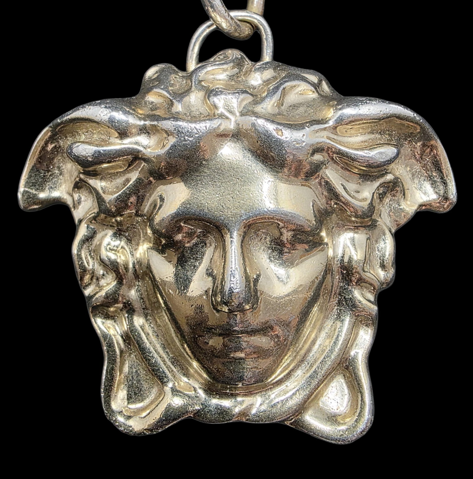 Vintage VERSACE Italy Stainless Steel Medusa Head Keychain: Very good vintage condition with some patina according to age. Measures approx. 5 1/4" long; Head measures approx. 2" long x 2 1/2" wide. Marked on the back.