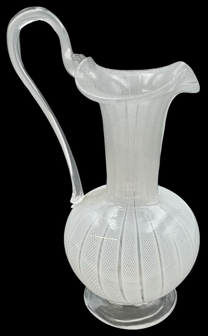 Delicate Vintage Murano Italy Mouthblown White & Clear Latticino Art Glass Pitcher: Very good vintage condition. No cracks, or repairs; tiny chip to the base of the handle. Measures approx. 4 2/8" high x 2" wide.