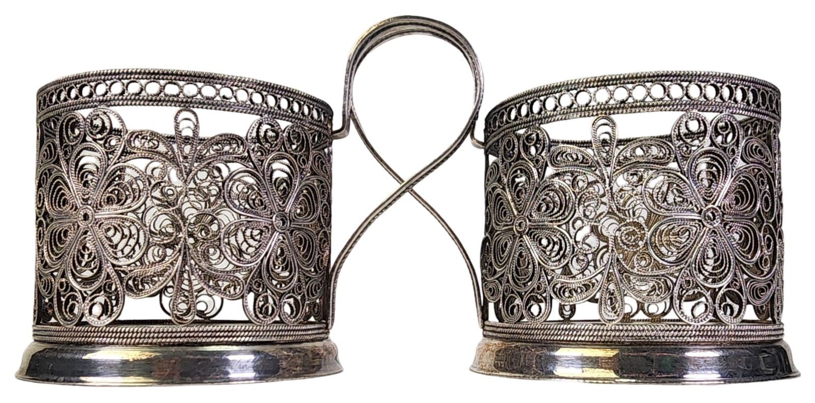 Pair of Vintage Handmade Russian 875 Filigree Silver Tea Cup Holders: Both pieces are in very good vintage condition with some patina according to age. Each measures approx. 3 1/2" x 3" in base diameter. Stamped.
