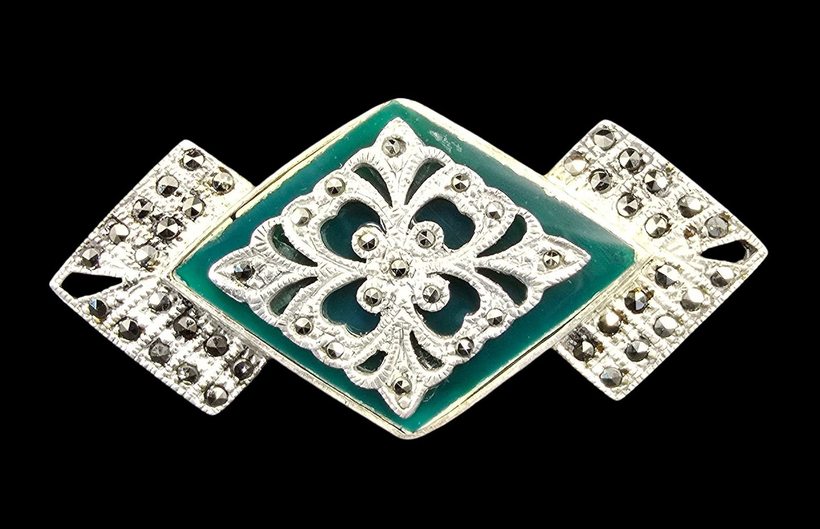 Vintage Art Deco Sterling Silver, Marcasite & Green Gemstone Brooch: Very good vintage condition with minor patina according to age. Measures approx. 2" wide and weighs ca. 9 grams. Marked for Sterling Silver.
