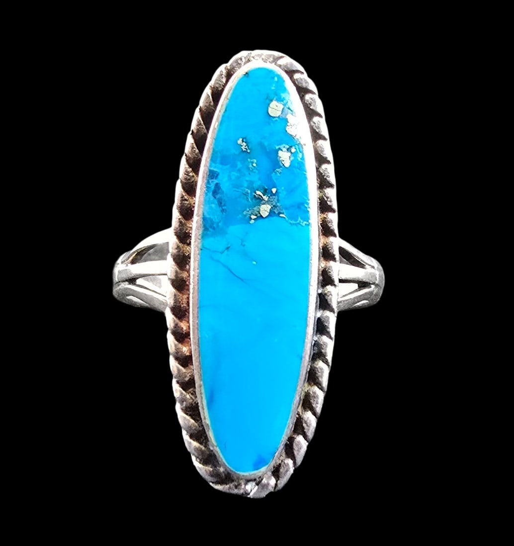 Dazzling Large Vintage Sterling Silver & Bright Blue Turquoise Ring: Very good vintage condition with minor patina according to age. Ring is a size 10 and weighs ca. 5.5 grams. Marked for Sterling Silver.