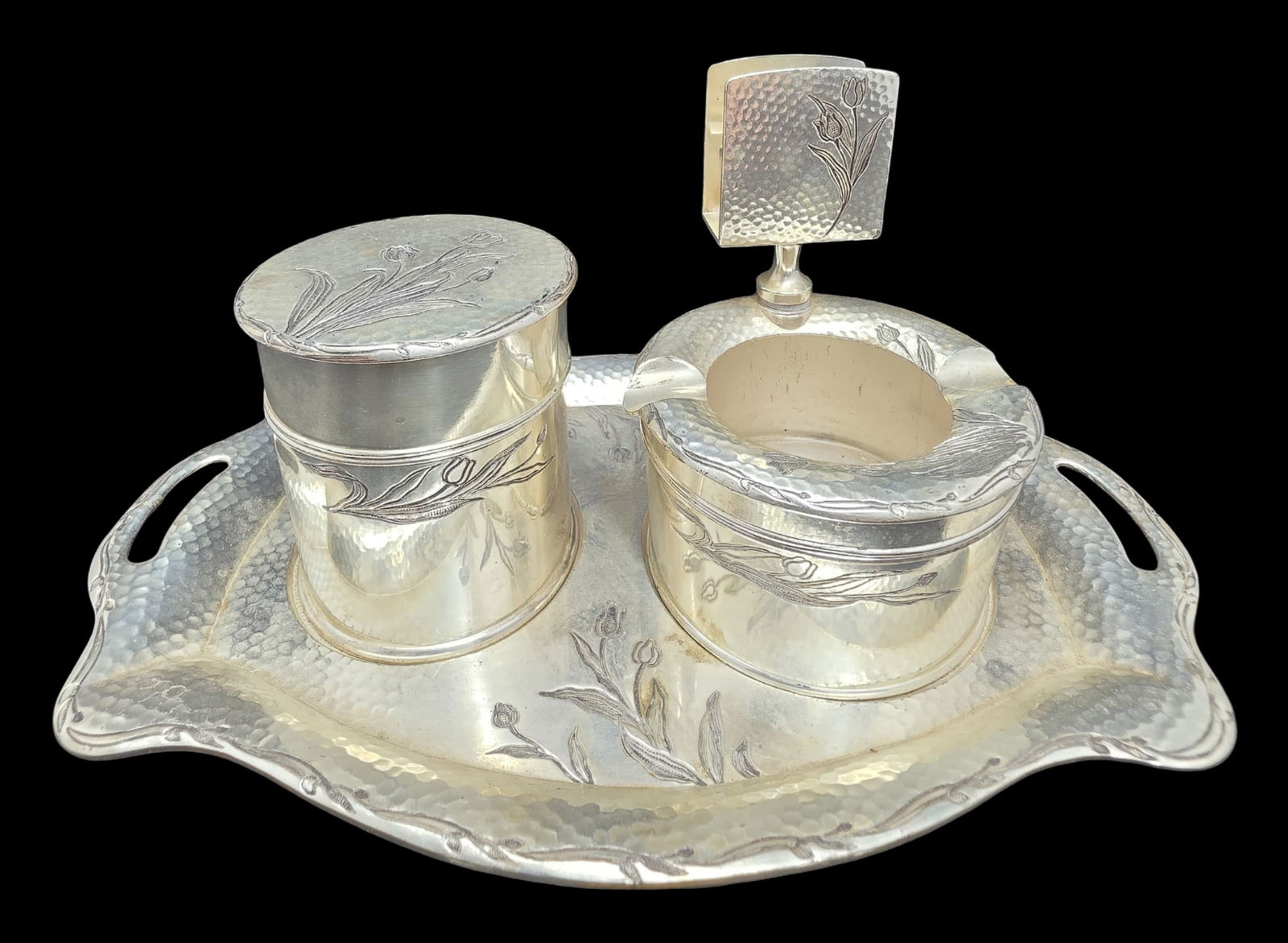 Elegant Vintage Hand Hammered Silverplate Smoking Set: This great set includes a tray, a lidded tobacco or cigarette jar, a matchbox holder, and an ashtray. Very good vintage condition with minor patina according to age. Tray measures approx. 9 5/9" long