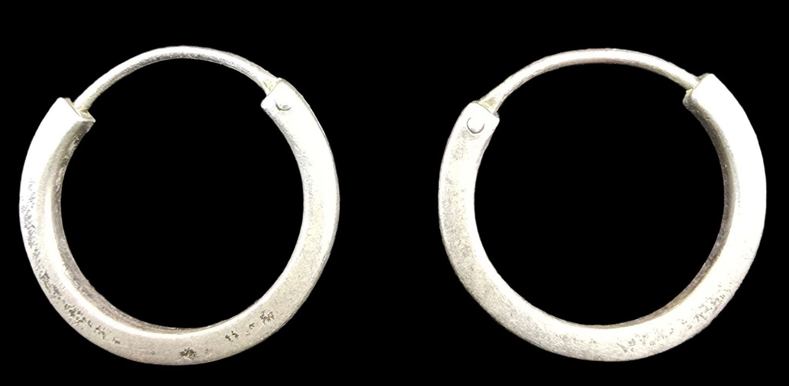 Pair of Vintage European 800 Silver Hoop Earrings: Very good vintage condition with minor patina according to age. Each measures approx. 1/2" wide and weighs ca. 1 gram SHIPPING: We ship in-house and charge a flat fee of $12 for any order of 5 small i