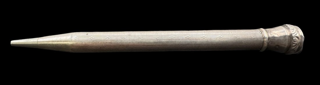Antique 1900s European Sterling Silver Pencil: Very good antique condition with minor patina according to age. Pendant Measures approx. 3 7/8" long x 3/8"wide and weighs ca. 13.1 grams. Marked for Sterling Silver & Life Long on Head. SHIPPING: We