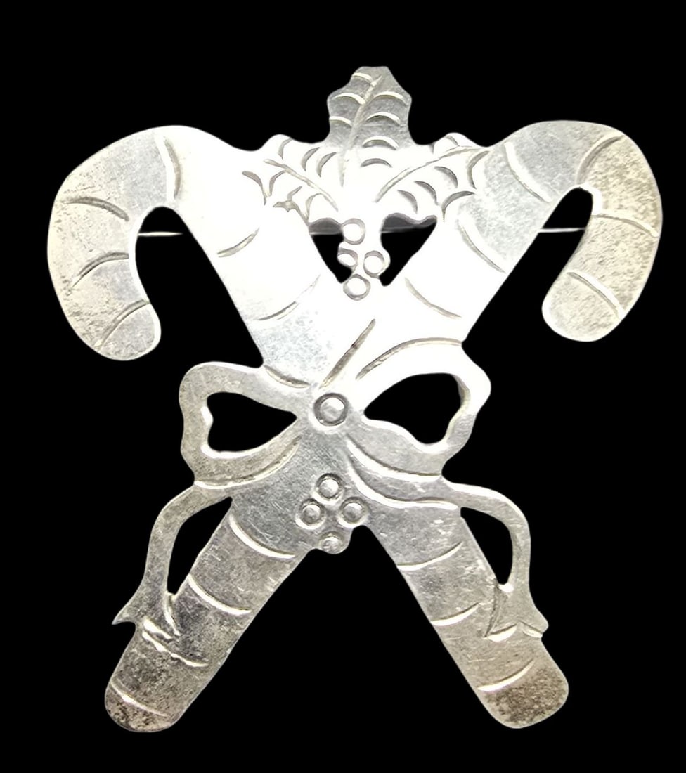 Whimsical Vintage Sterling Silver Candy Cane Brooch: Very good vintage condition with minor patina according to age. Measures approx. 2" wide and weighs ca. 9.5 grams. Marked. SHIPPING: We ship in-house and charge a flat fee of $12 for any order of 5 sm