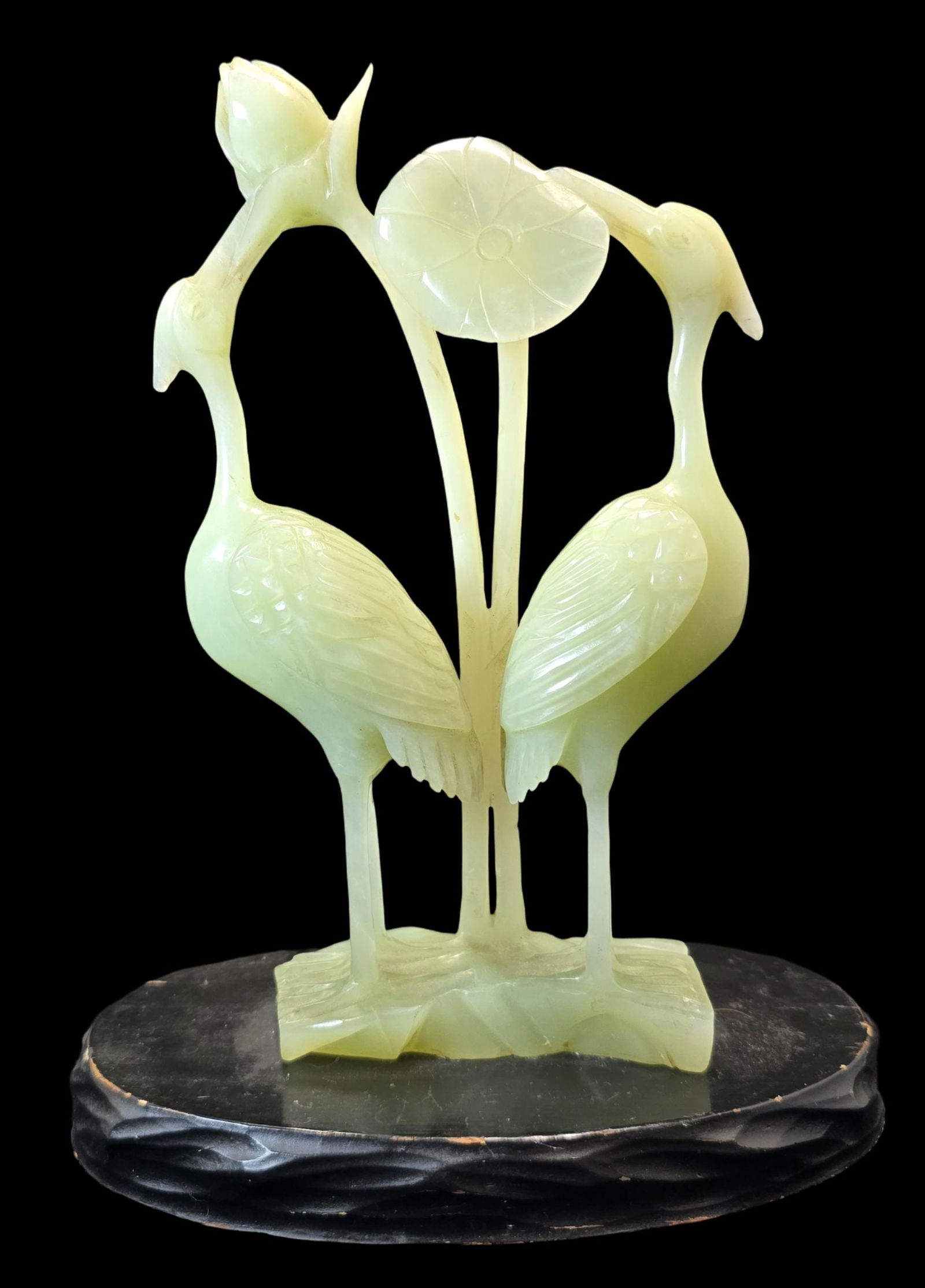 Antique Handcarved Chinese Celadon Serpentine Crane Sculpture on Wood Base: Very good antique condition with minor wear according to age; no chips, cracks, or repairs. Measures approx. 9" high x 7" wide.