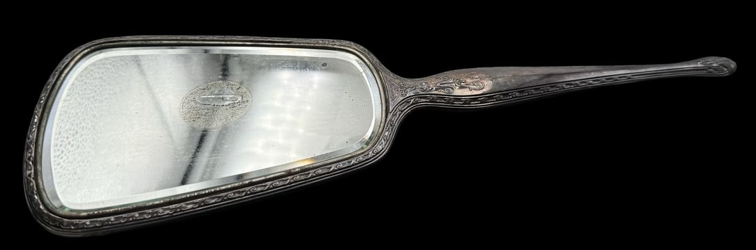 Antique Victorian Sterling Silver Lady's Hand Mirror: Very good antique condition with minor patina according to age and some silvering loss to mirror surface. Measures approx. 14" long x 4 1/2" wide. Marked for Sterling Silver.