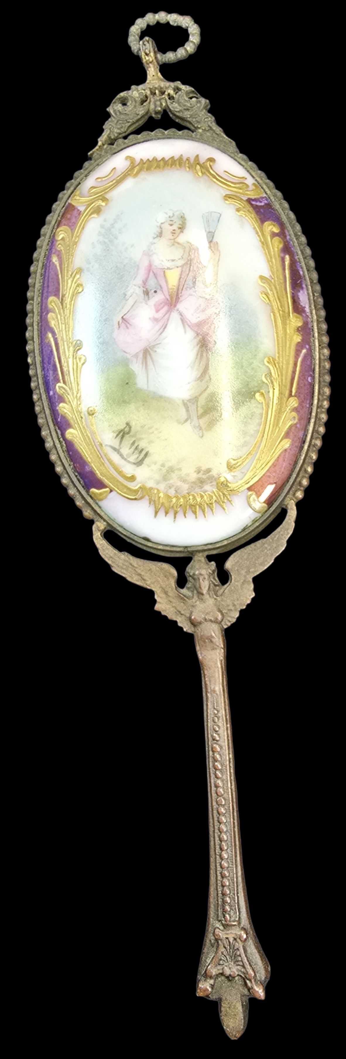 Antique 19th Cent. French Bronze Ormolu Hand Mirror /w Porcelain Portrait Plaque: An antique 19th Century French bronze hand mirror with a hand-painted porcelain portrait of a woman. Very good antique condition with wear and patina according to age. Measures approx. 6" high x 2" wi