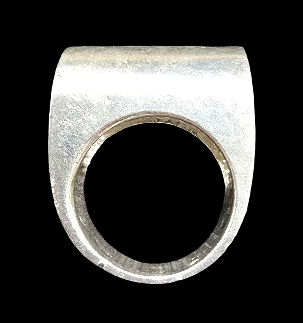 Unusual & Stylish Vintage Mid-Century Modern Sterling Silver Ring: Very good vintage condition with minor patina according to age. The ring is a size 7 and weighs ca. 18.5 grams. Marked for Sterling Silver.