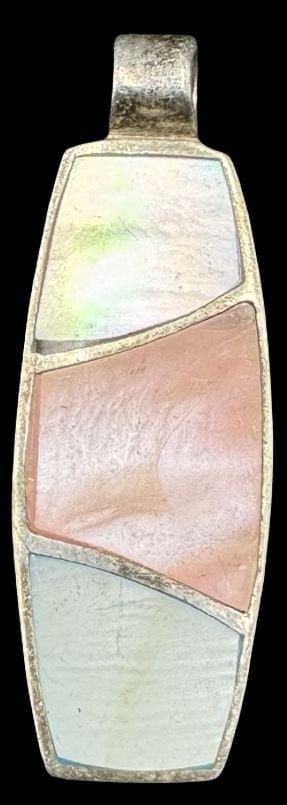 Gorgeous Vintage Sterling Silver & Mother of Pearl Pendant: Very good vintage condition with minor patina according to age. Pendant measures approx. 1 1/8" long x 1/2" wide and weighs ca. 7.6 grams. Marked for Sterling Silver.