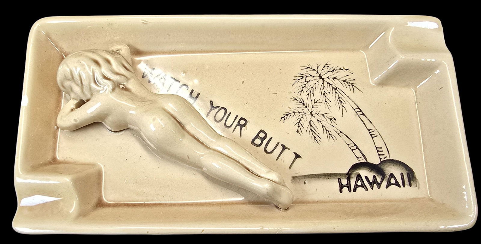 Unusual Vintage 1960s "Watch Your Butt" Ceramic Ashtray: Very good vintage condition with minor wear according to age, please see pictures. No cracks or repairs. Measures approx. 1" high x 6" long.