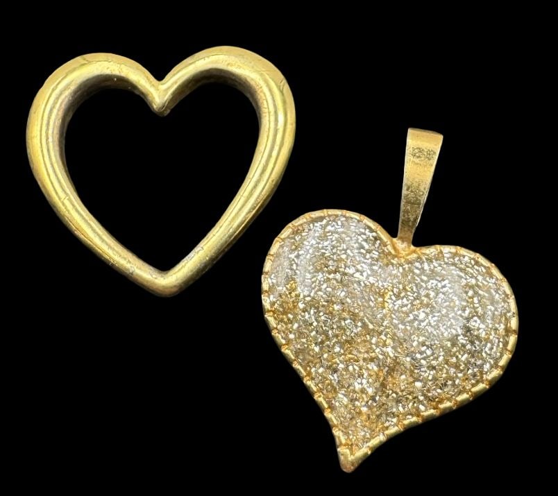 Pair of Vintage Gilt Sterling Silver Heart Pendants: Very good vintage condition with minor patina according to age. Each measures approx. 5/8 " long and 5/8" wide & they jointly weigh ca. 1.8 grams. Marked for Sterling Silver.