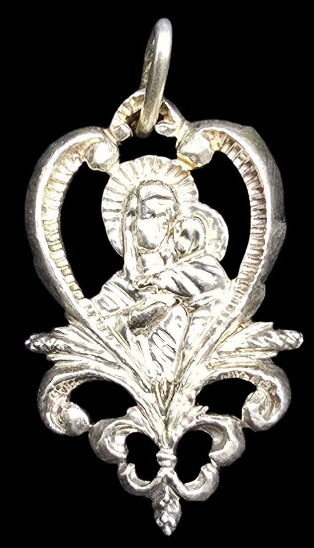Ornate Vintage Sterling Silver Religious Christian Mary /w Child Jesus Pendant: Very good vintage condition with minor patina according to age. Measures approx. 1" high and weighs ca. 2.5 grams. Tested for Sterling Silver.