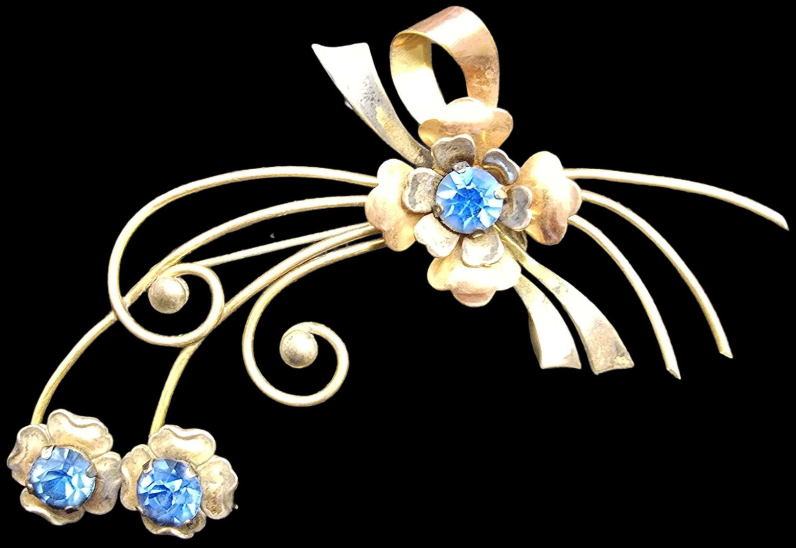 Beautiful Vintage HARRY ISKIN 1/20 12K Gold Filled Blue Rhinestone Flower Brooch Pin: Very good vintage condition with minor patina according to age. Measures approx. 2" high x 3" wide and weighs ca. 9 grams. Marked.