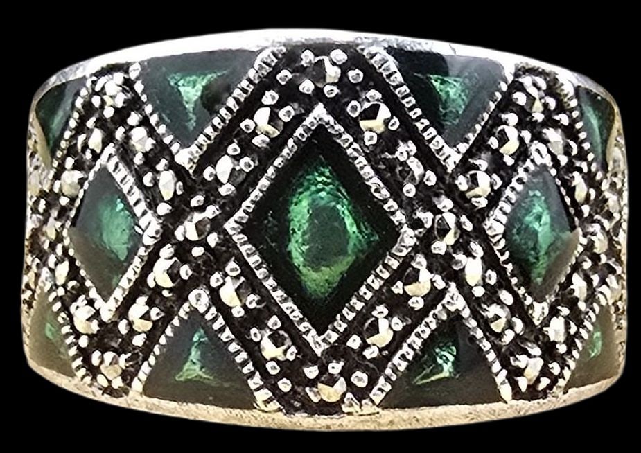 Very Unusual Vintage Sterling Silver Designer Ring /w Green Gemstones: Very good vintage condition with minor patina according to age. The ring is a size 6 and weighs ca. 9.5 grams. Marked for Sterling Silver & Designer.