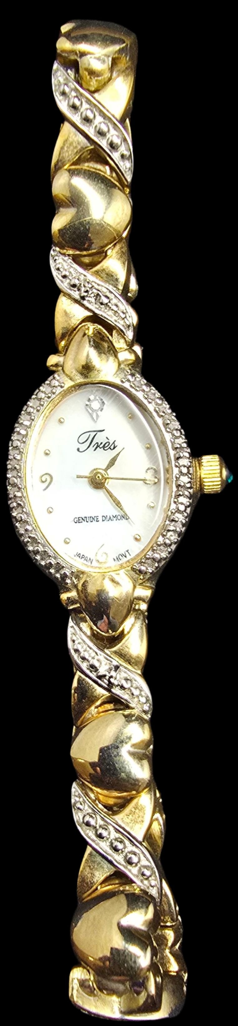 Beautiful TRES Vintage Stainless & Genuine Diamonds Ladies Watch: Very good vintage condition with minor patina according to age; works (but needs a new battery). Measures approx. 7 1/2" long and weighs ca. 31 grams.