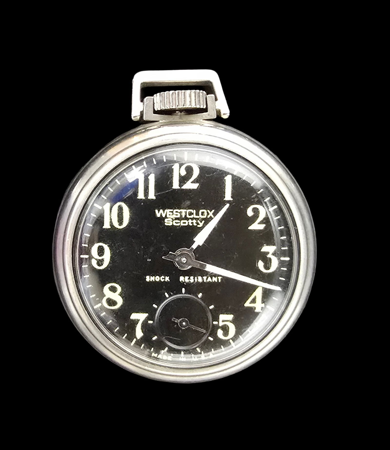 Amazing Vintage WESTCLOX SCOTTY Silver-Tone Pocket Watch /w Black Dial: Very good vintage condition with minor patina according to age. Measures approx. 2 1/2" long x 2" wide and weighs ca. 38 grams.