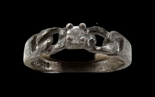 Vintage Sterling Silver & Clear Gemstone Ring: Very good vintage condition with minor patina according to age. The The ring is a size 5 and weighs ca. 1.9 grams. Marked for Sterling Silver.and carrying an unidentified designer mark.