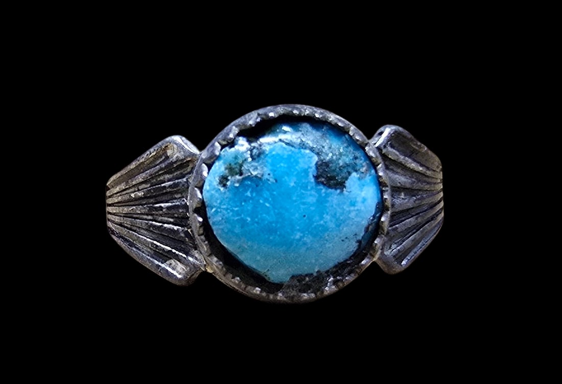 Mid-Century Southwestern PACIFIC JEWELRY COMPANY Sterling Silver & Turquoise Ring: Very good vintage condition with minor patina according to age. The ring is a size 2 and weighs ca. 1 grams. Marked for Sterling Silver.