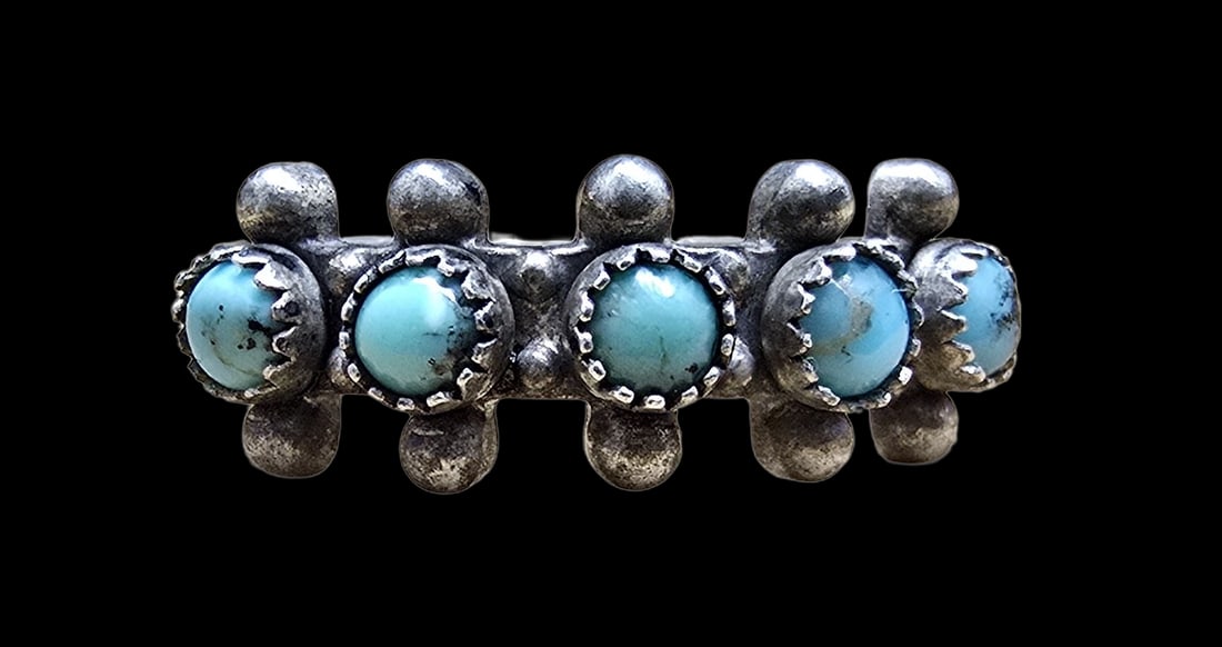 Mid-Century Southwestern Sterling Silver & Turquoise Ring: Very good vintage condition with minor patina according to age. The ring is a size 6.5 and weighs ca. 3 grams. Marked for Sterling Silver.