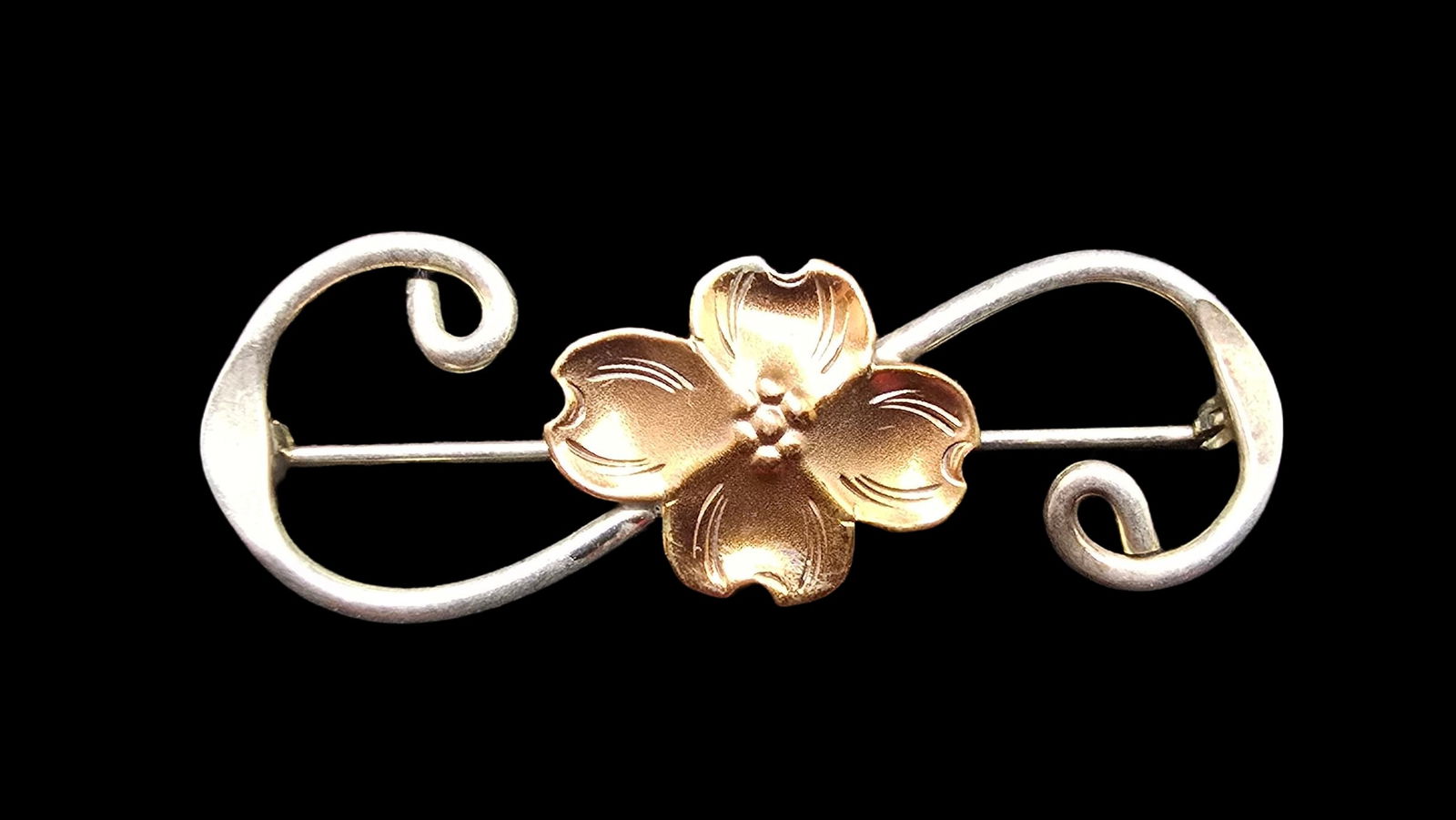 Beautiful Vintage Sterling Silver Dogwood Flower Brooch Pin: Very good vintage condition with minor patina according to age. Measures approx. 1 1/2" long and weighs ca. 3 grams. Marked for Sterling Silver.