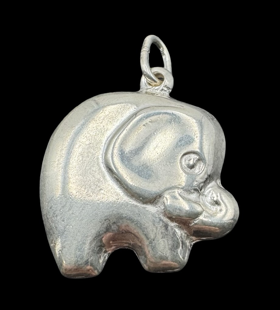Vintage Italian Sterling Silver Elephant Pendant: Very good vintage condition with minor patina according to age. Measures approx. 1 1/8" long and 3/4" wide & weighs ca. 3.8 grams. Marked for Sterling Silver. Made in Italy.