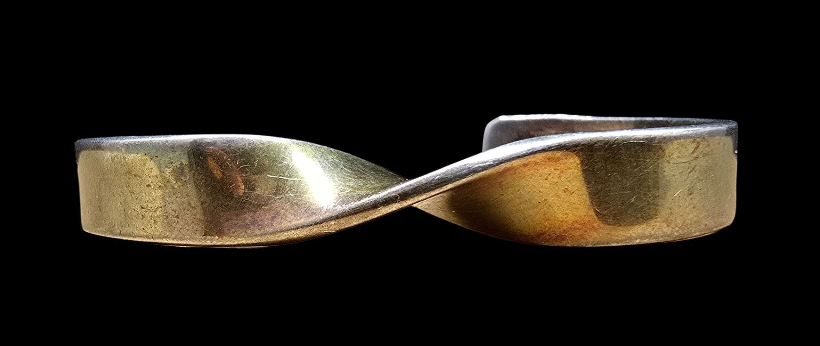 Stylish Vintage Mid-Century Modern Mexican Sterling Silver Twisted Cuff Bracelet: Very good vintage condition with minor patina according to age. Measures approx. 2 " high x 2 1/2" wide (inside diameter) and weighs ca. 22.5 grams. Marked for Sterling Silver.