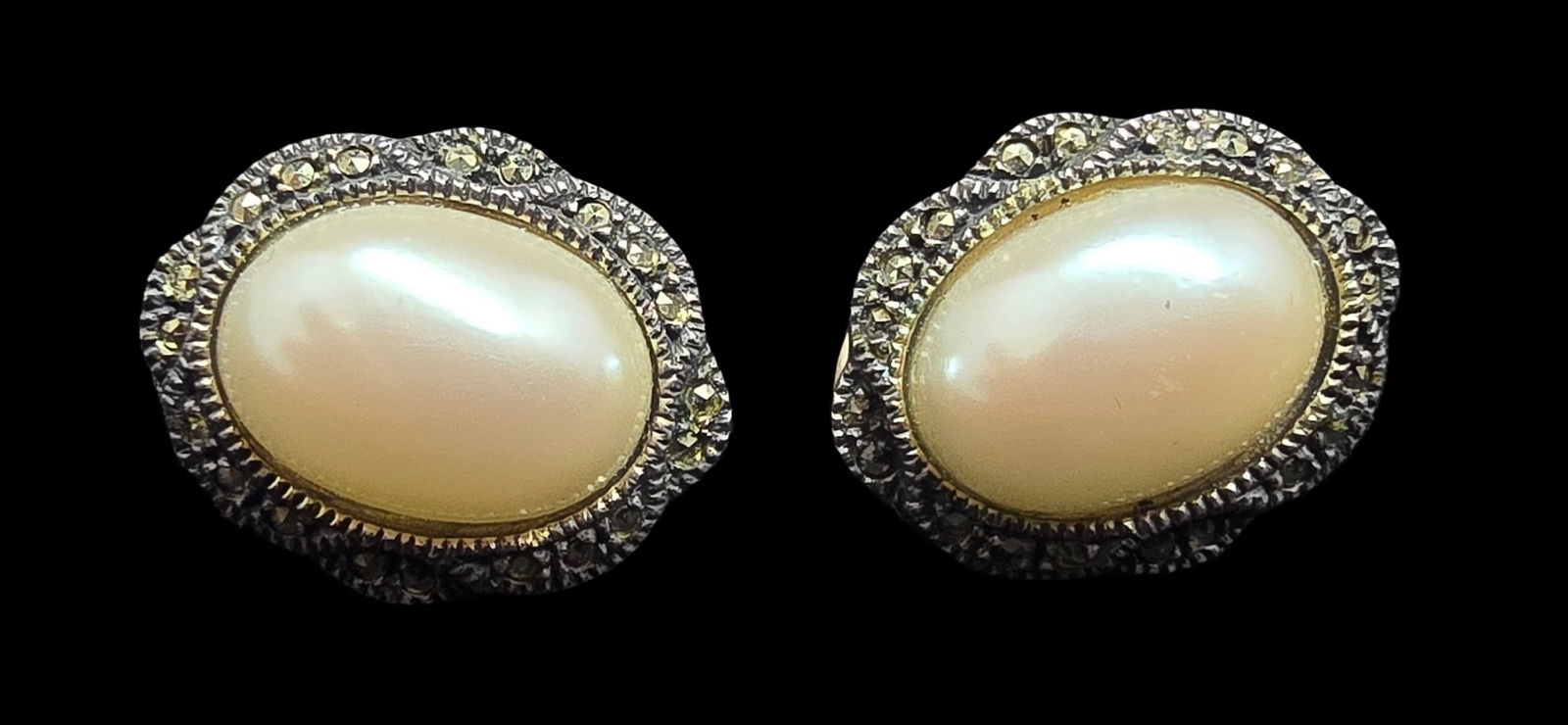 Elegant Vintage Sterling Silver,Macasite & Mabe Pearl Designer Clip-On Earrings: Very good vintage condition with minor patina according to age. Each measures approx. 1" long and they jointly weigh ca. 7 grams. Marked for Sterling Silver & Designer.