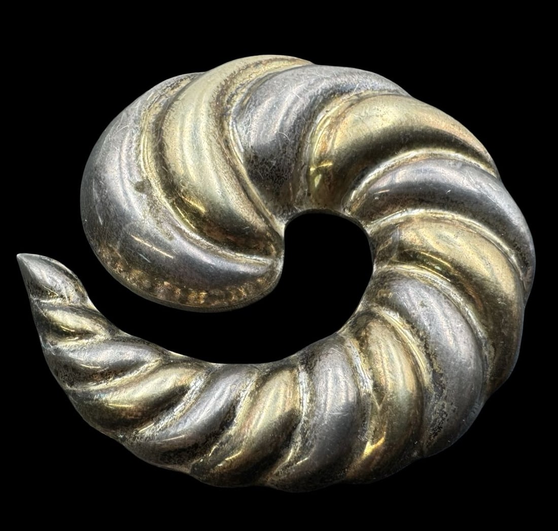 Unusual Vintage Mexican Two-Tone Sterling Silver Spiral Shell Shaped Brooch: Very good vintage condition with minor patina according to age. Measures approx. 2 1/2" long & 2 1/2" wide & weighs ca. 25.7 grams. Marked for Sterling Silver.and carrying an unidentified designer mar