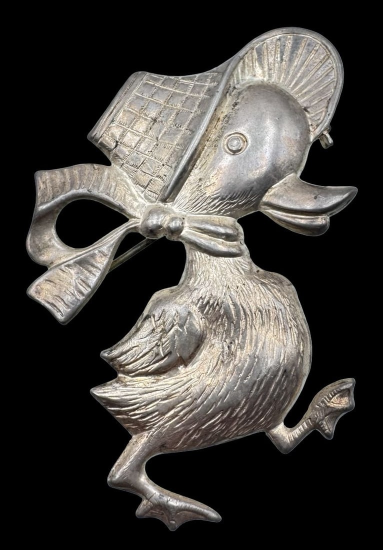 Charming Vintage Sterling Silver Baby Duck Brooch Pin: Very good vintage condition with minor patina according to age. Measures approx. 2 1/2" long x 1 1/2" wide and weighs ca. 6.4 grams. Unidentified desinger . Marked for Sterling Silver.