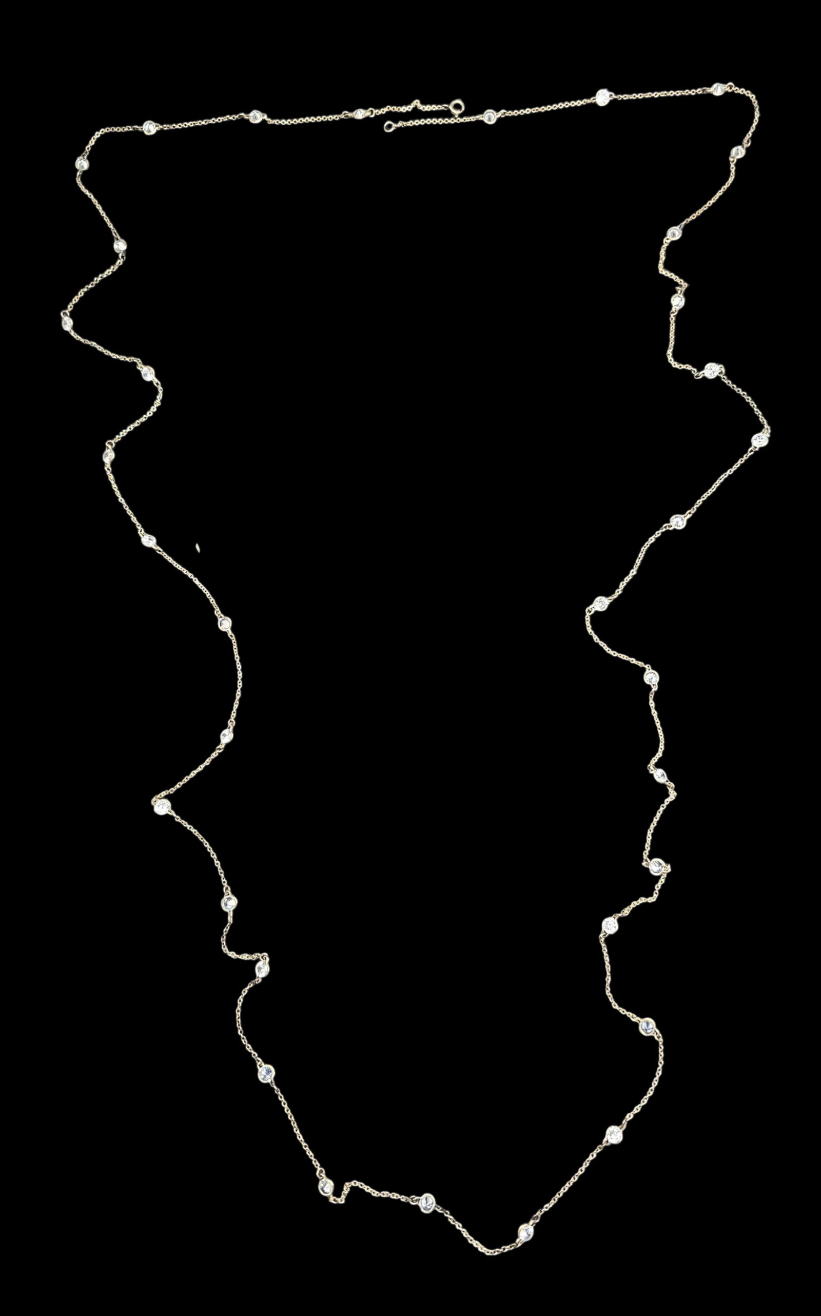 Very Long Vintage Sterling Silver & Clear Rhinestone Necklace: Very good vintage condition with minor patina according to age. Measures approx. 29" long and weighs ca. 15 grams. Marked for Sterling Silver.