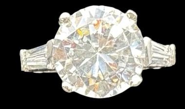 Vintage Sterling Silver & Clear Rhinestone Engagement Ring: Very good vintage condition with minor patina according to age. Measures approx. 5/8" long and 5/8" wide and weighs ca. 2.8 grams. The ring is a size 7. Marked for Sterling Silver.