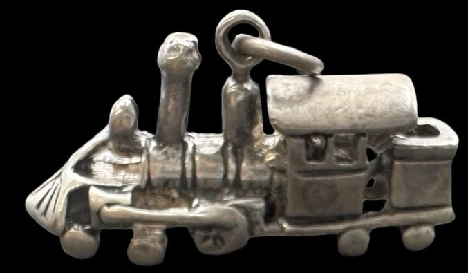 Vintage Sterling Silver Locomotive Train Pendant Charm: Very good vintage condition with minor patina according to age. Measures approx. 1" long and 5/8" wide and weighs ca. 4.2 grams. Marked for Sterling Silver.