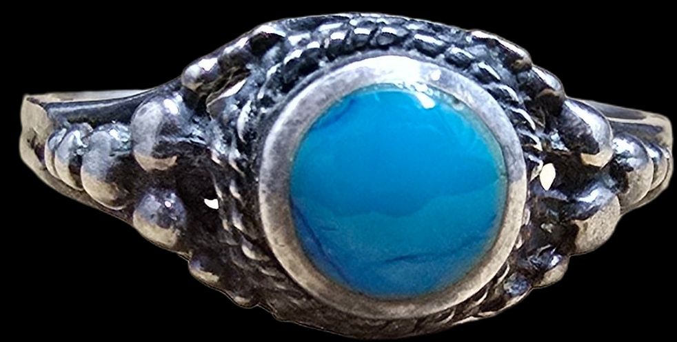 Beautiful Vintage Sterling Silver Ring /w Blue Gemstone: Very good vintage condition with minor patina according to age. The ring is a size 4 and weighs ca. 1 grams. Marked for Sterling Silver.
