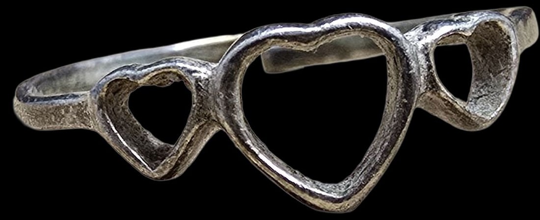 Whimsical Vintage Sterling Silver Three Hearts Love Ring: Very good vintage condition with minor patina according to age. The ring is a size 6.5 and weighs ca. 0.9 grams. Marked for Sterling Silver.