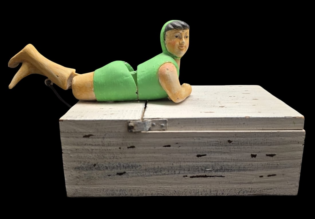 Unusual Vintage Hand-Operated Wooden Automaton Box /w Swimmer Figurine: Very good vintage condition; No chips, cracks, or repairs; could use a cleaning. Measures approx. 2 1/2" high x 5" wide x 7" long (Girl measures approx. 6" long x 2" wide x 3" high.