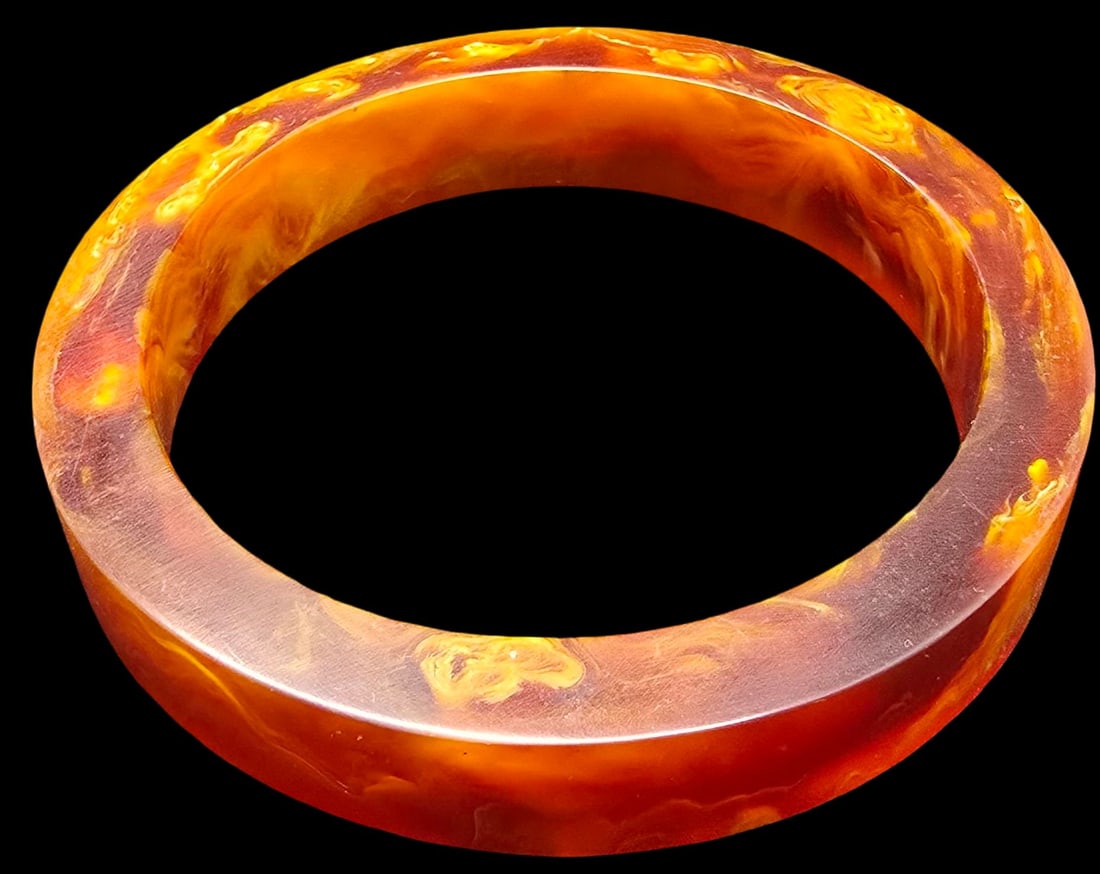 Wonderful Vintage Orange Bakelite Bangle Bracelet: Very good vintage condition with minor patina according to age. Measures approx. 3 1/2" in diameter and weighs ca. 30 grams.