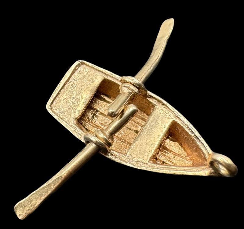 Whimsical Vintage 1930s 14K Gold Boat Charm /w Movable Paddles: Very good vintage condition with minor patina according to age. Measures approx. 5/8" long x 1/4" wide and weighs ca. 1.5 grams. Marked.