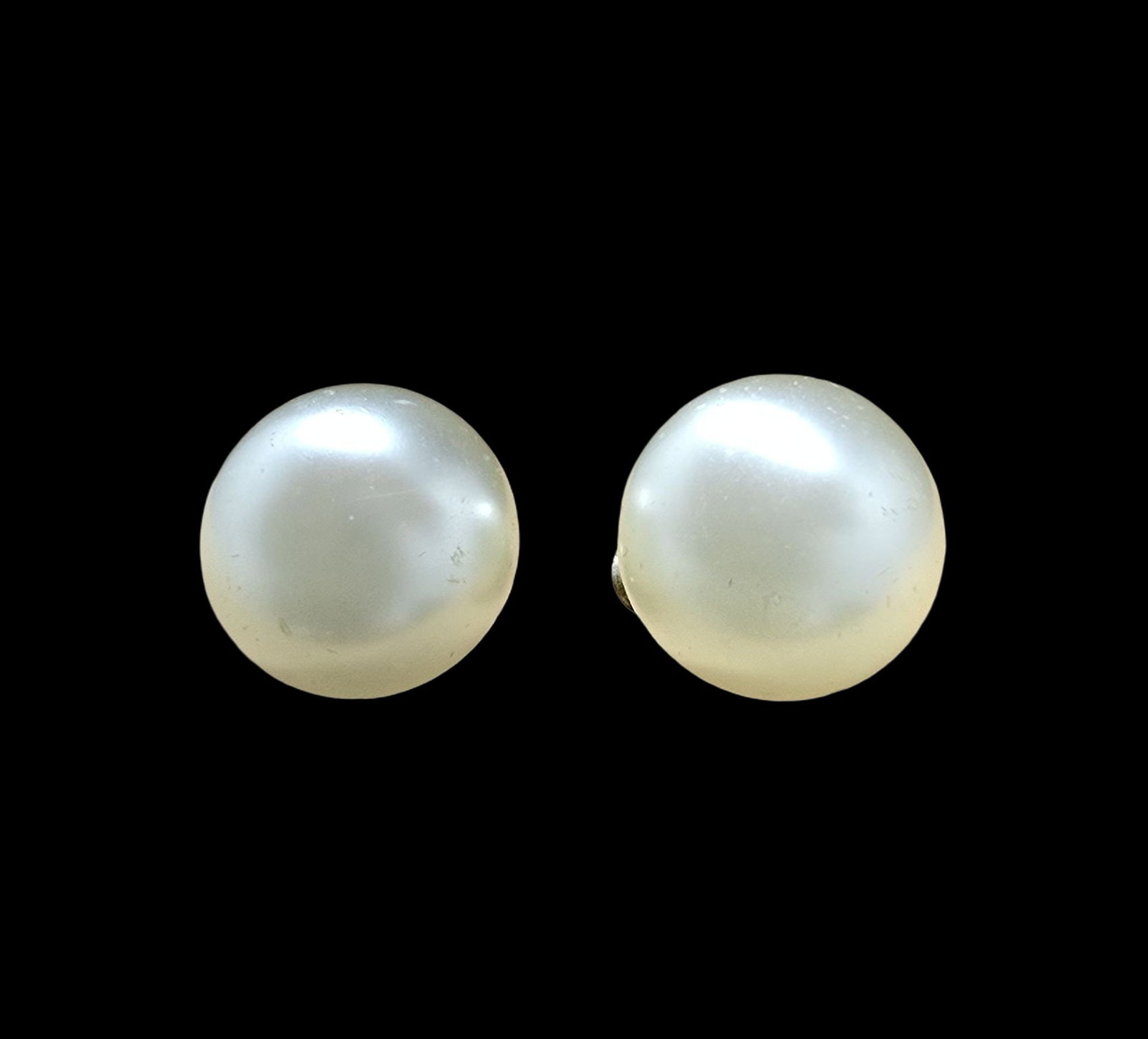 Beautiful Vintage Sterling Silver & White Pearl Clip-On Earrings: Very good vintage condition with minor patina according to age. Measures approx. 1/2" wide and weighs ca. 6 grams. Marked for Sterling Silver..