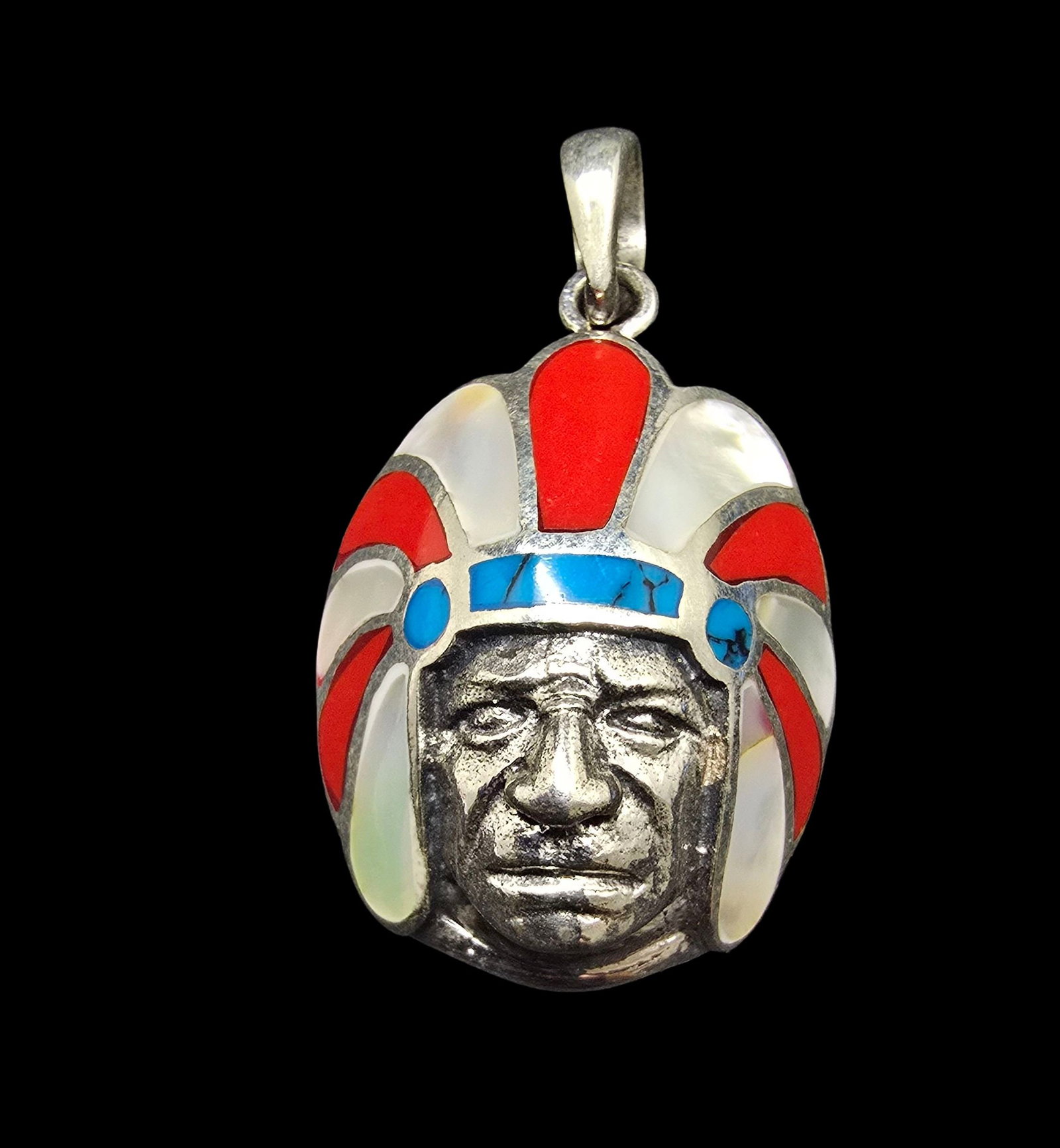 Amazing Vintage Sterling Silver & Inlaid Gemstone Indian Chief Head Pendant: Very good vintage condition with minor patina according to age. Measures approx. 1" wide and weighs ca. 3.5 grams. Marked for Sterling Silver.