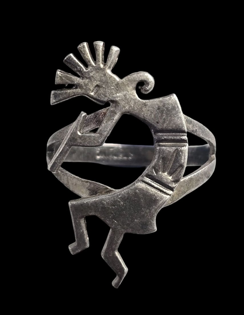 Vintage Mexican Southwestern Anasazi Sterling Silver Kokopelli Ring: Very good vintage condition with some wear and patina according to age. The ring is a size 8 and weighs ca. 3.5 grams. Marked for Sterling Silver..