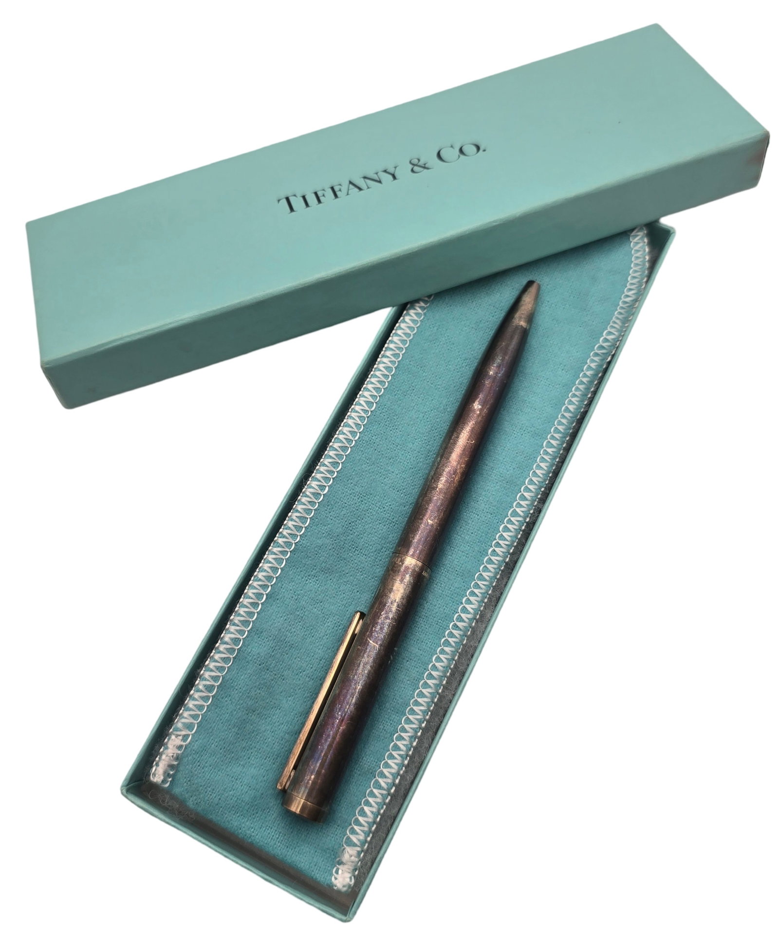 Vintage Tiffany & Co. Sterling Silver Pen: Good vintage condition with some wear and patina according to age. Measures approx. 5 1/2" long. Fully marked; comes in the original box.